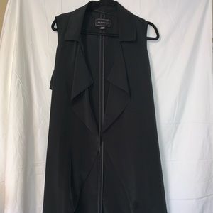 Long vest with belt.